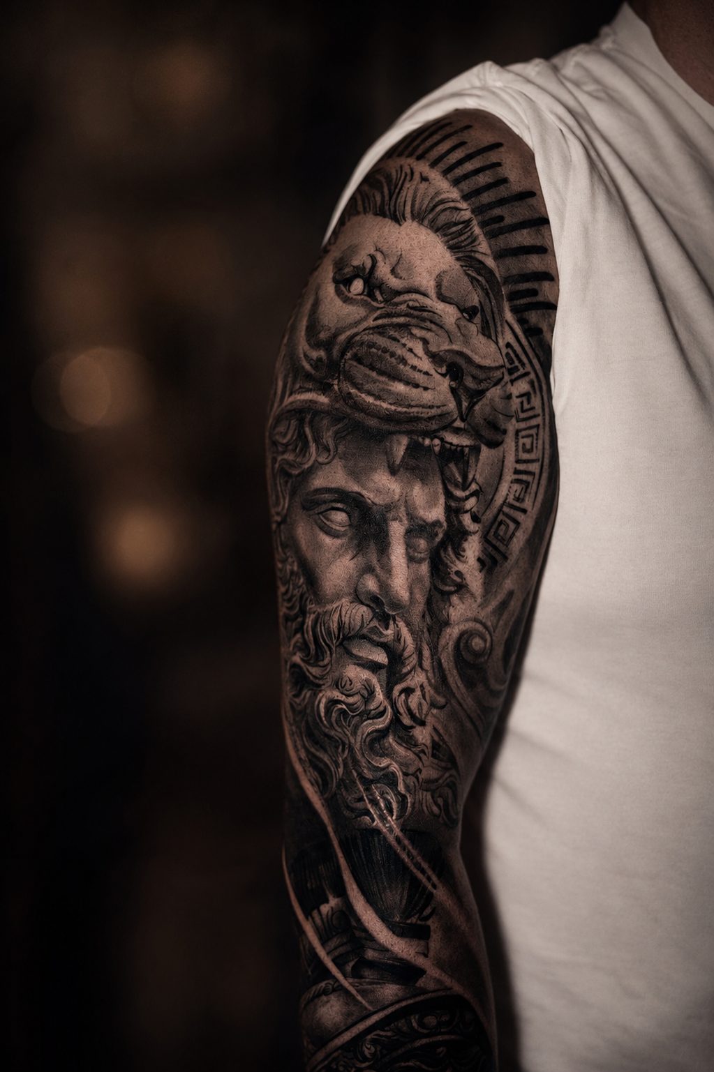 Greek god and lion black and grey sleeve by Erkan Zarif at THRONE Northampton