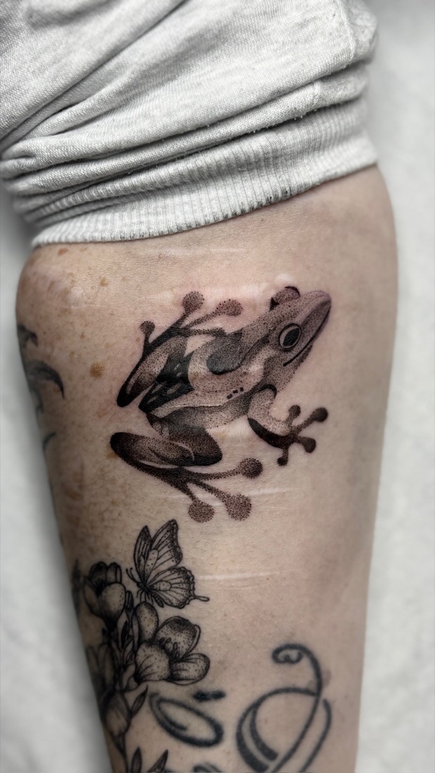 Dotwork frog on a forearm, black and grey, by Tuba at THRONE Northampton