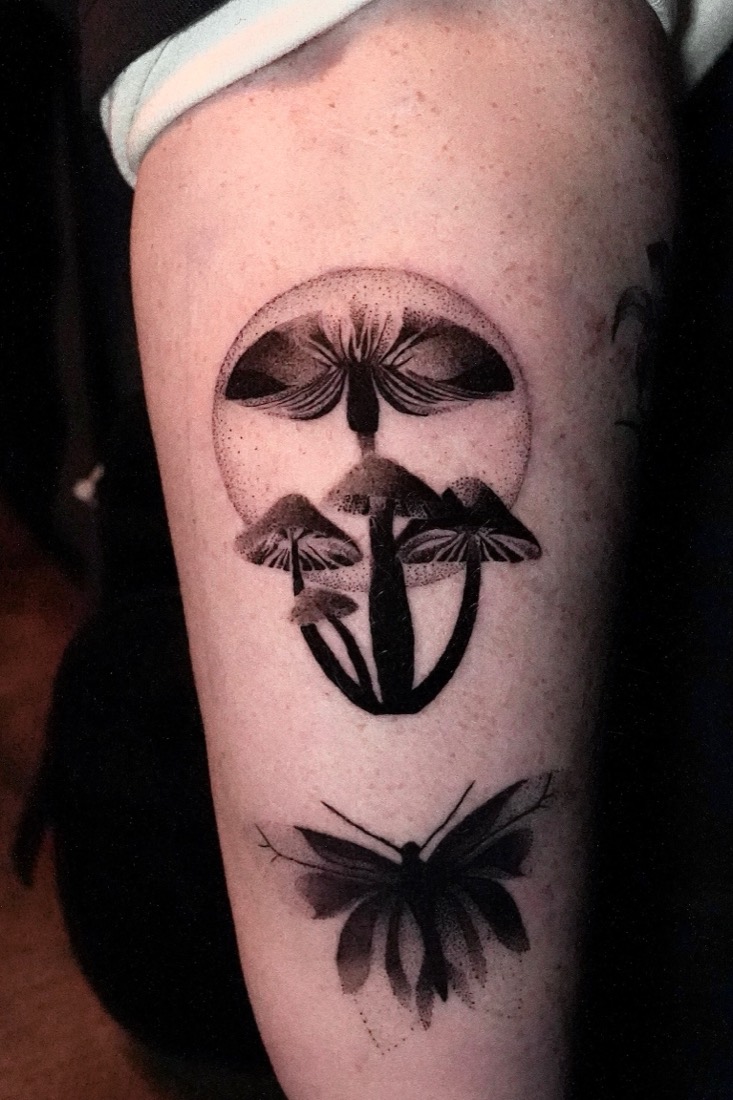 Mushrooms inside a dotwork circle with a moth beneath, on a thigh, by Tuba at THRONE Northampton