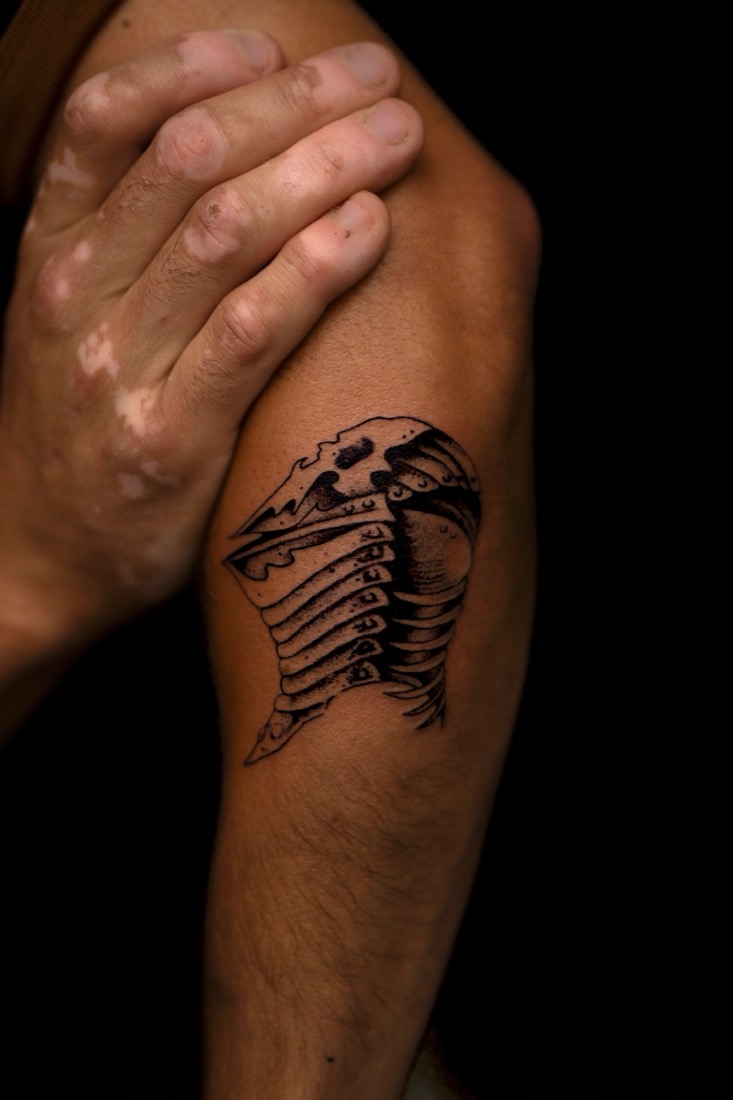 Trilobite shell in line and dotwork on an arm, by Tuba at THRONE Northampton